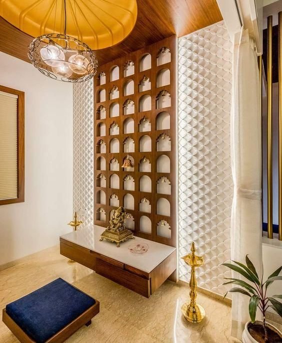 Luxury pooja room with carved lattice detail